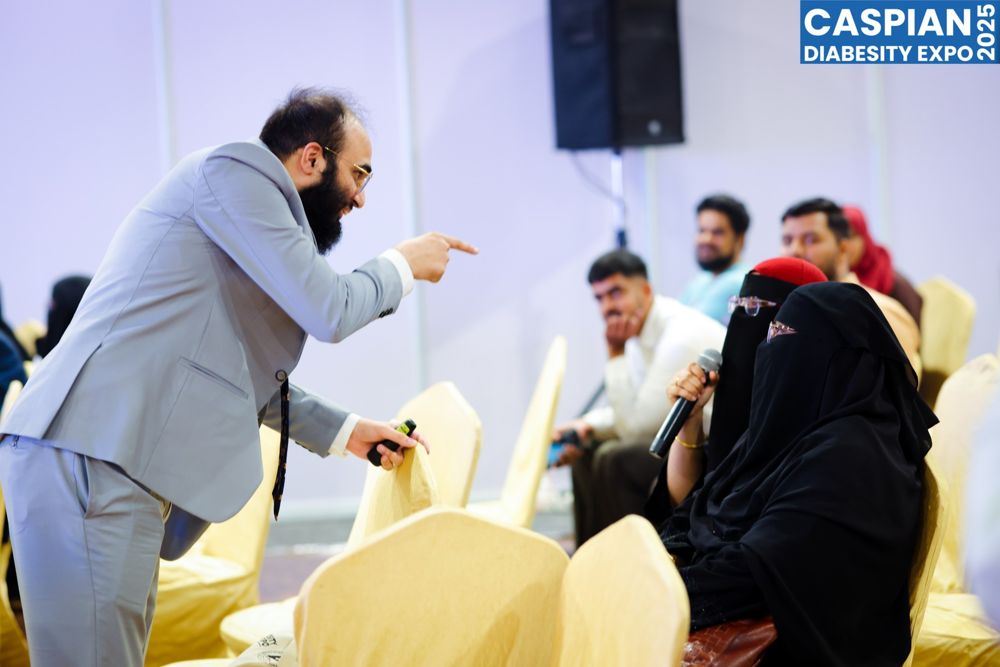 Women in the audience answering during an interactive session