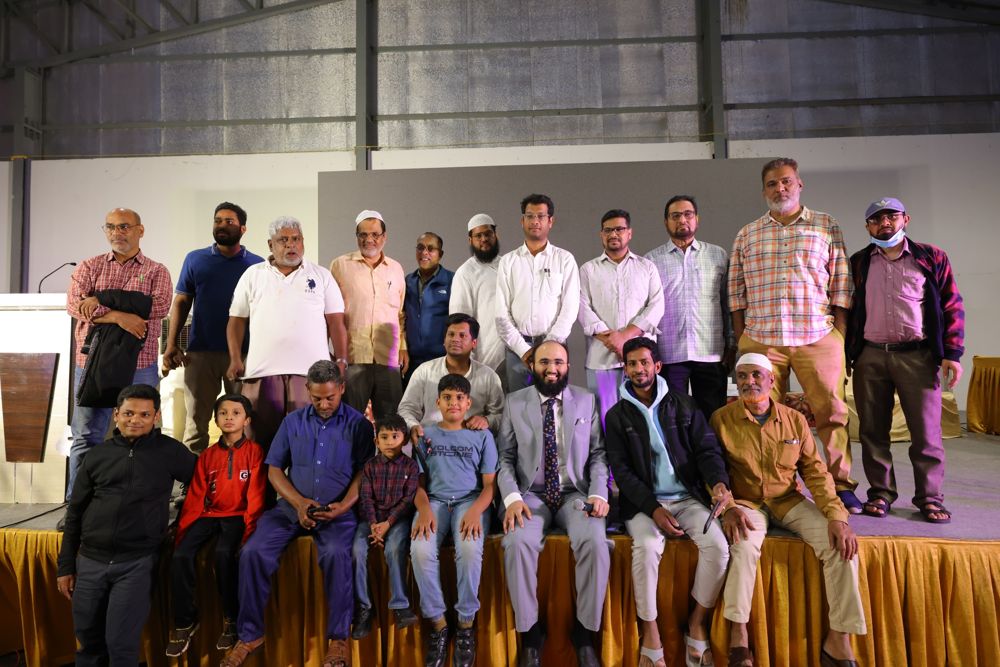 Community members and children gathered on stage
